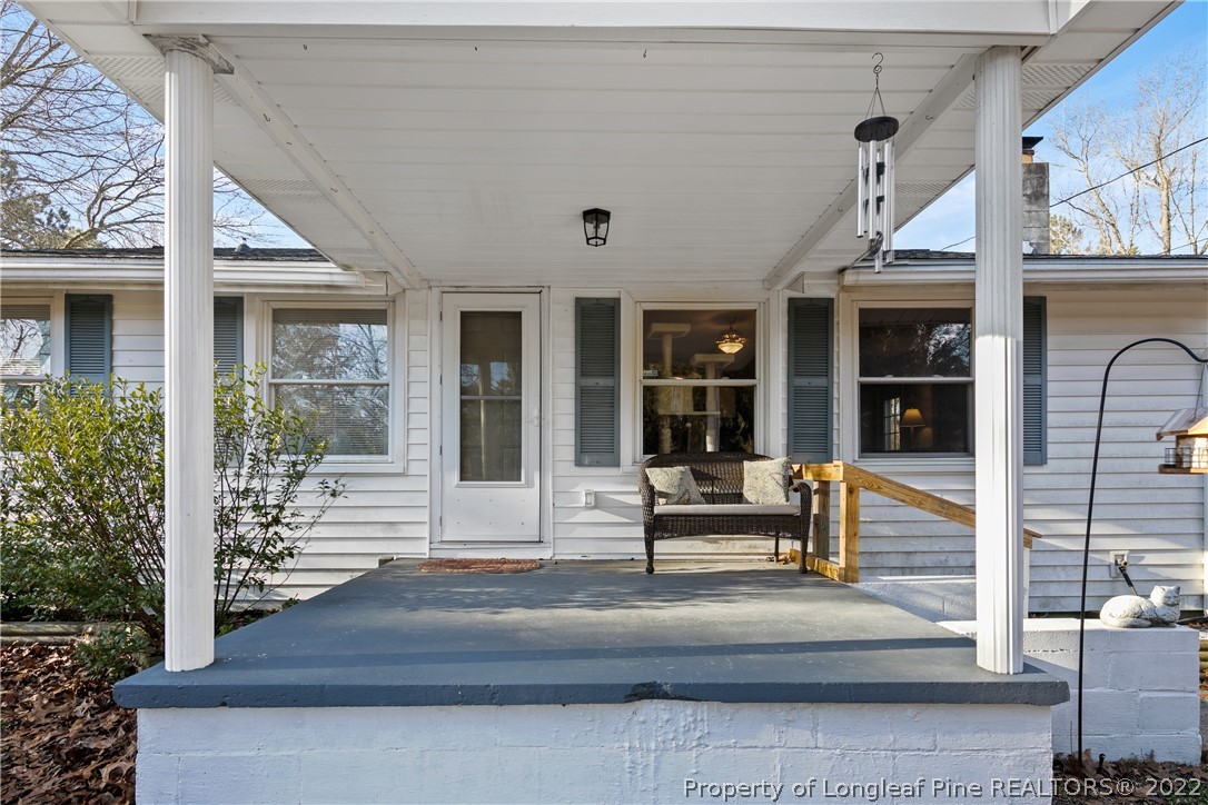 628 Tc Jones Road Raeford, NC 28376 - Photo 5 of 46 a front view of a house with a porch
