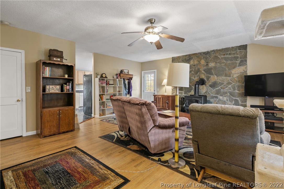 628 Tc Jones Road Raeford, NC 28376 - Photo 7 of 46 a living room with furniture and a flat screen tv