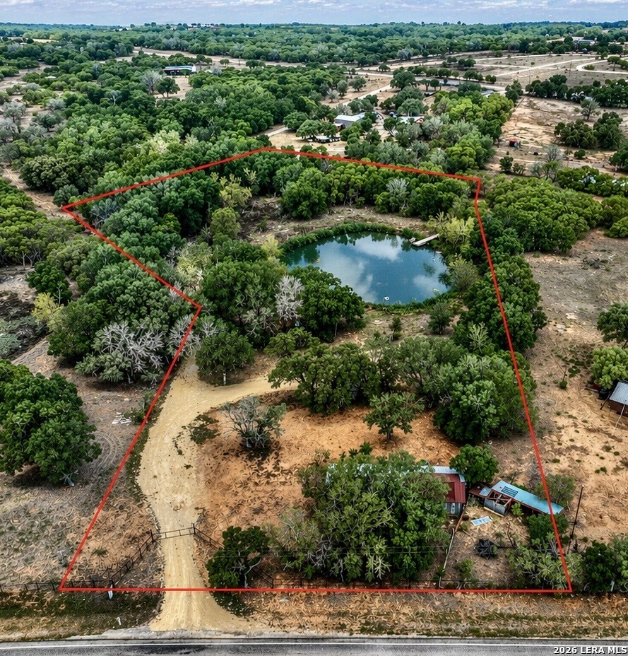 418 Fm 2984 Luling, TX 78648 - Photo 1 of 15 an aerial view of residential house with outdoor space and trees all around