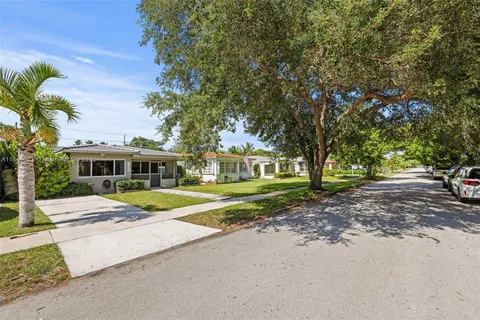 a house with trees in front of it