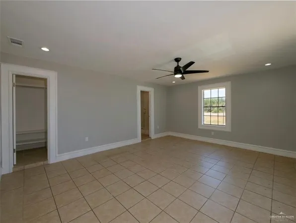 an empty room that has a window in it