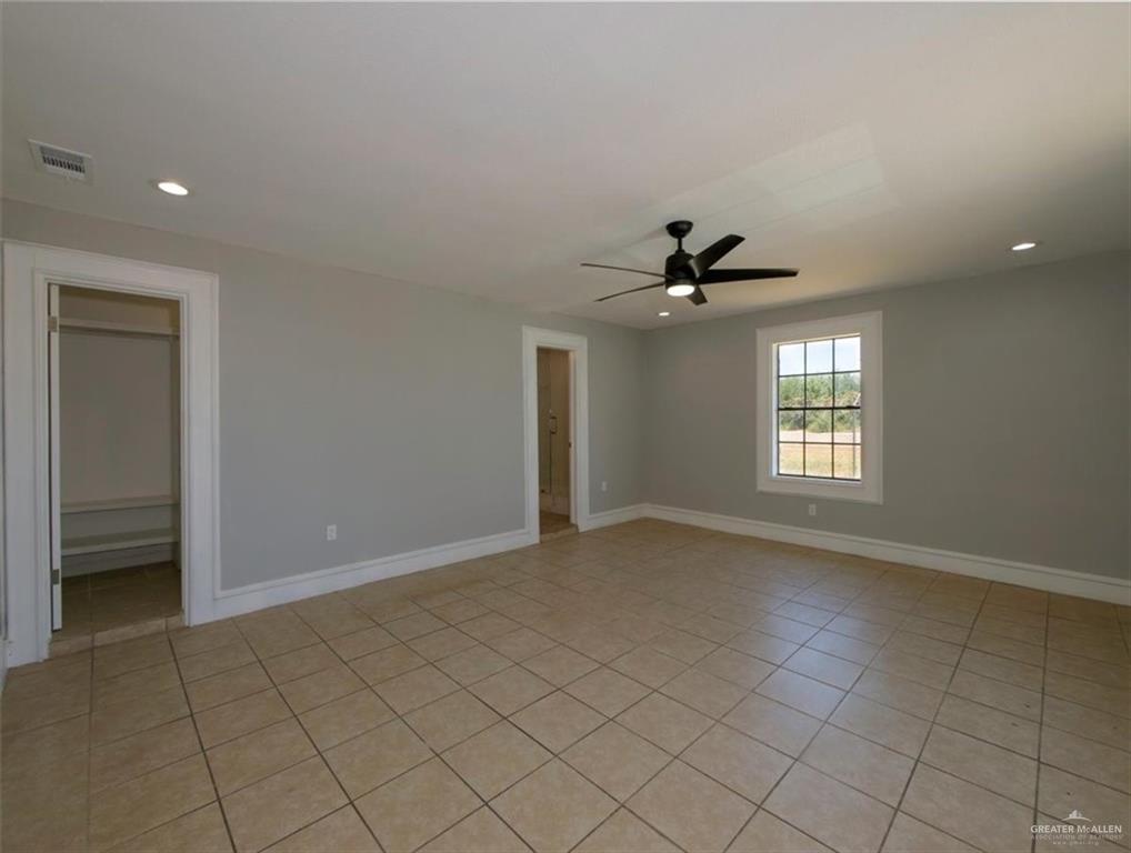 4507 West Rogers Road Edinburg, TX 78541 - Photo 12 of 21 an empty room that has a window in it