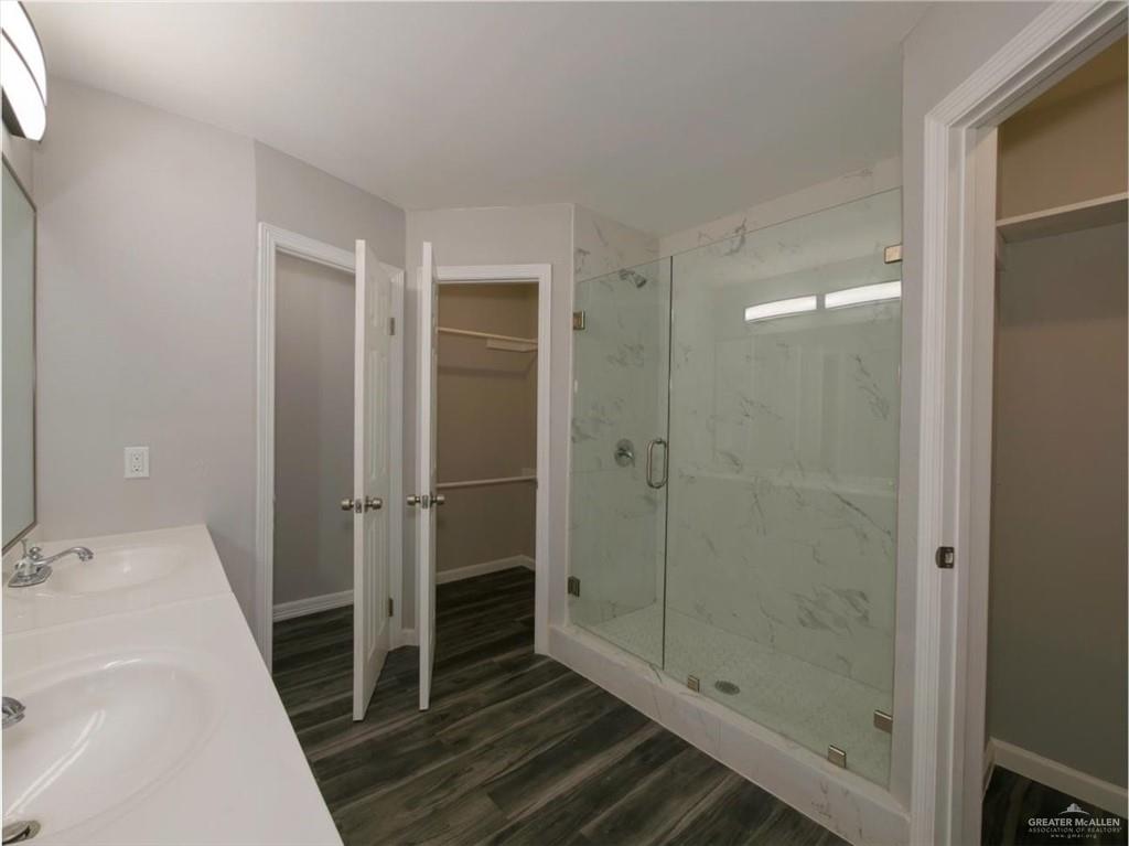 4507 West Rogers Road Edinburg, TX 78541 - Photo 17 of 21 a bathroom with a shower and a sink