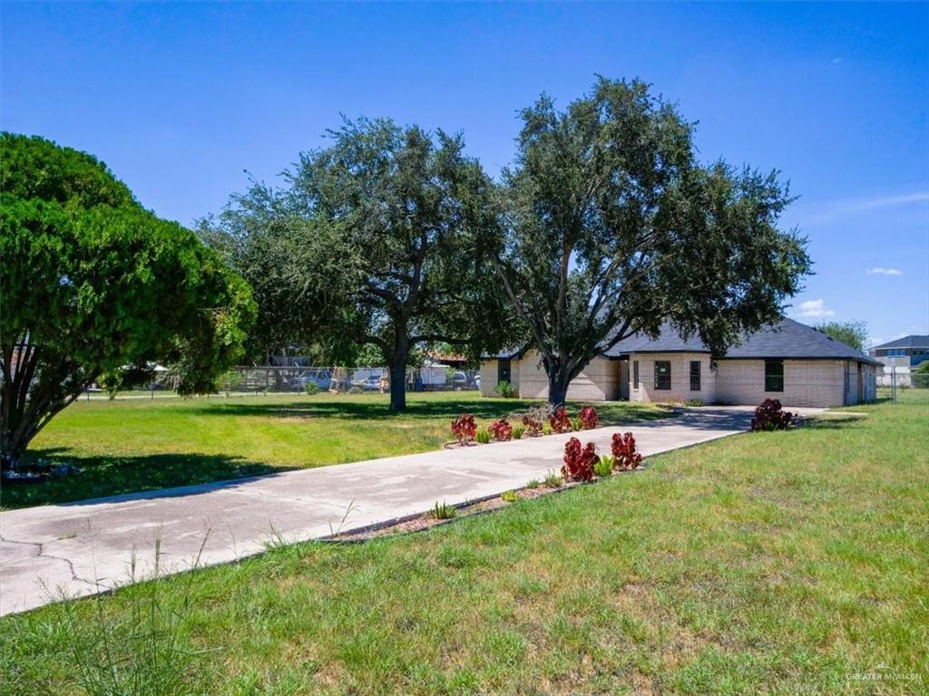 4507 West Rogers Road Edinburg, TX 78541 - Photo 3 of 21 a view of a house with a yard porch and sitting area