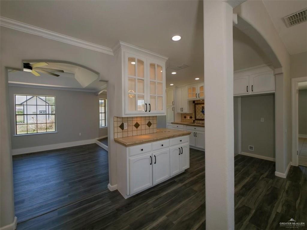 4507 West Rogers Road Edinburg, TX 78541 - Photo 5 of 21 a kitchen with granite countertop a sink and cabinets