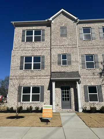 a front view of a house with yard