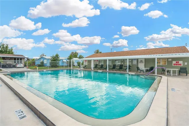a view of a swimming pool with a sitting space
