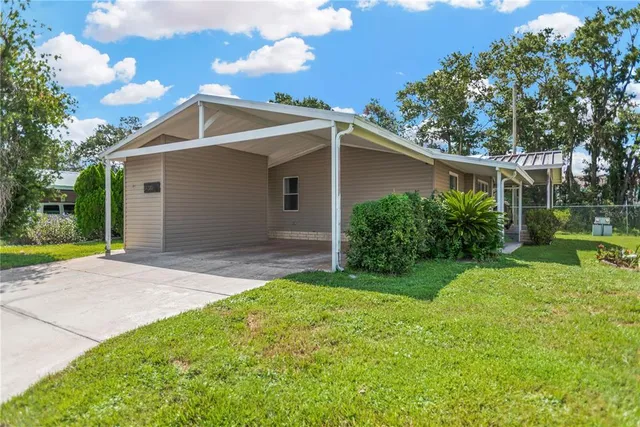 a view of a yard in front view of a house