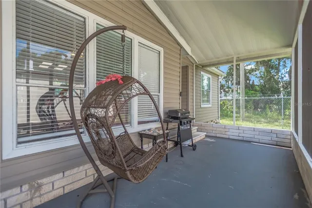 a view of a room with furniture and wooden floor