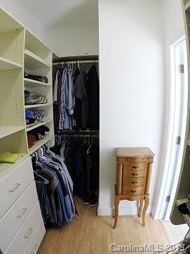 1407 Henry Smith Road Monroe, NC 28110 - Photo 14 of 23 a view of walk in closet with clothes and shoes