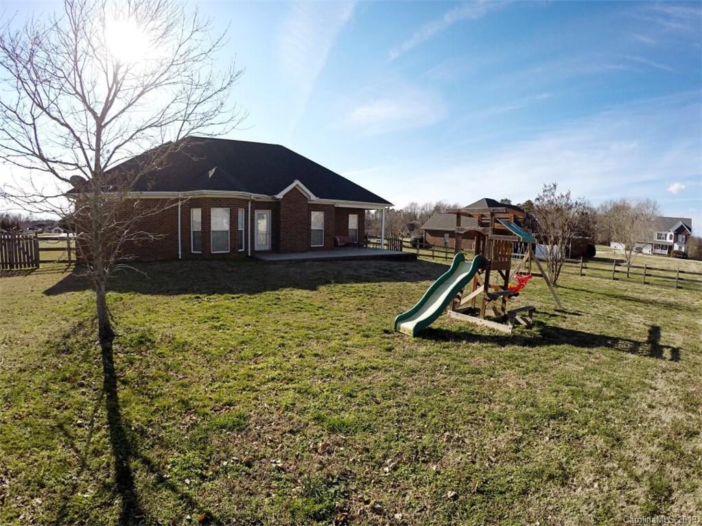 1407 Henry Smith Road Monroe, NC 28110 - Photo 22 of 23 a view of a house with a yard