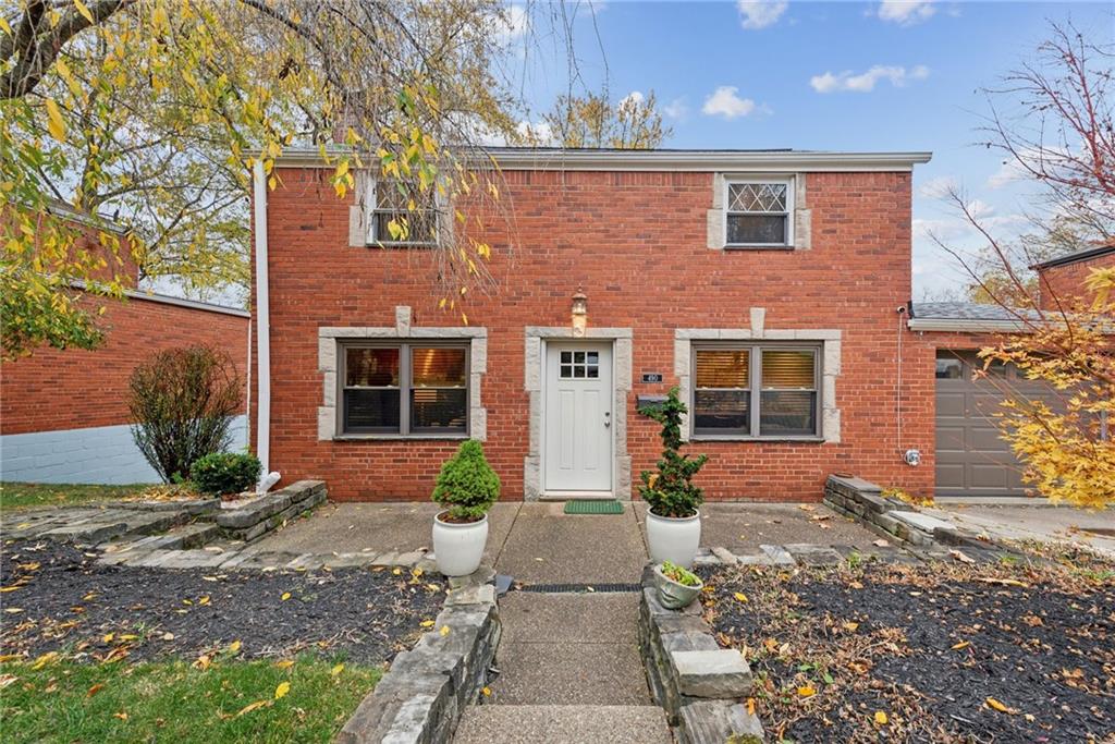 490 Haverhill Road Pittsburgh, PA 15228 - Photo 44 of 46 a front view of a house with a yard and potted plants