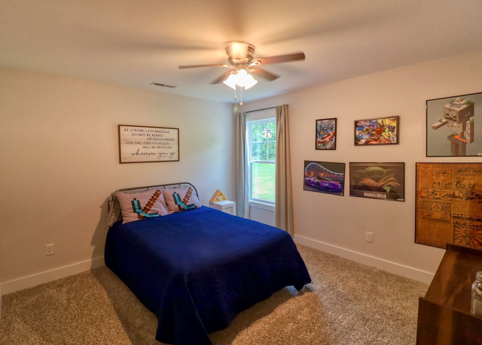 1658 Center Star Road Columbia, TN 38401 - Photo 19 of 36 a bedroom with a bed and a chandelier