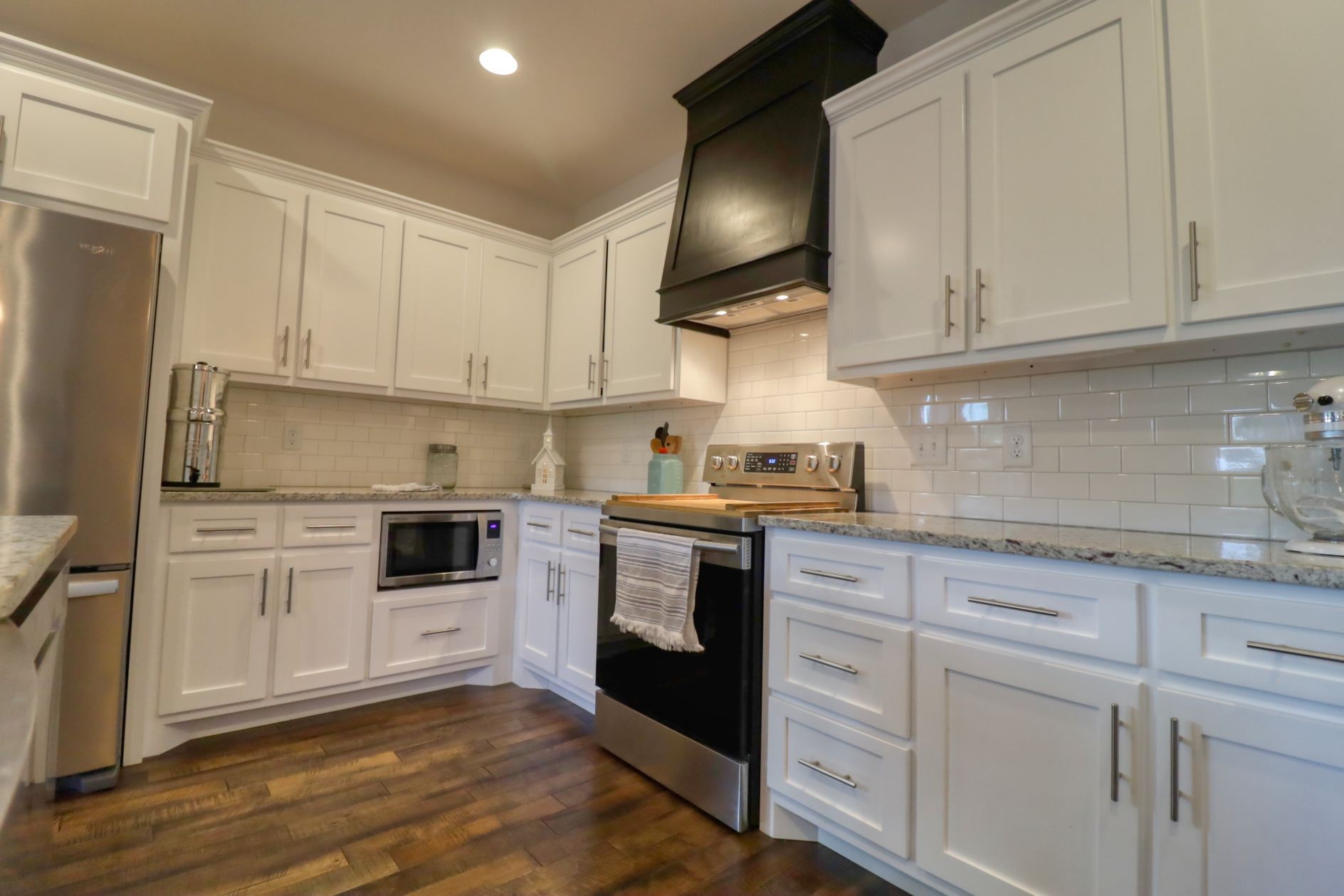 1658 Center Star Road Columbia, TN 38401 - Photo 10 of 36 a kitchen with white cabinets stainless steel appliances and sink