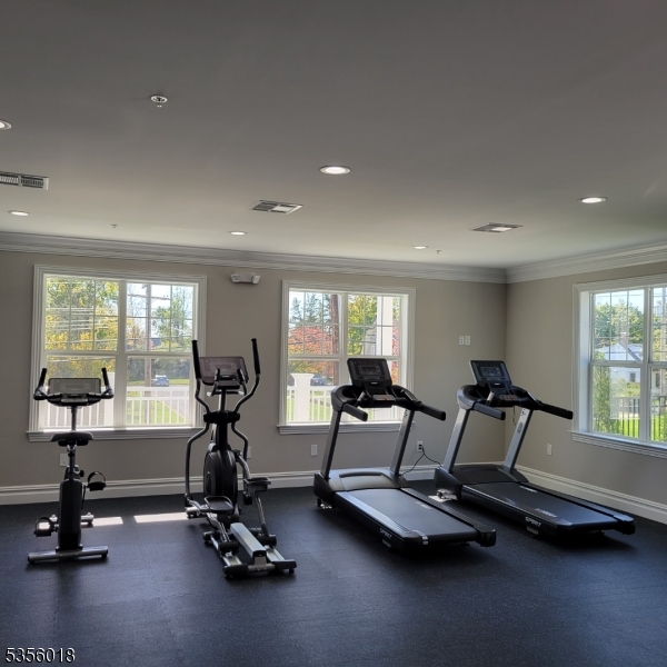 2435 Lamington Road, Unit 33 Bedminster, NJ 07921 - Photo 4 of 9 a view of a room with gym equipment