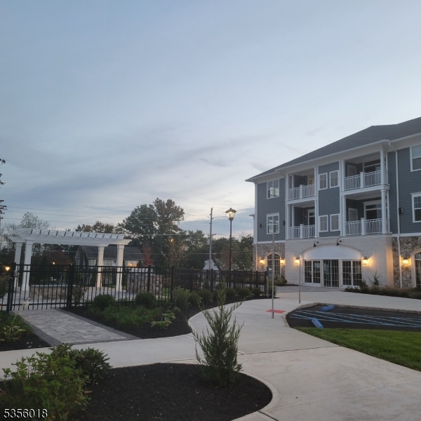 2435 Lamington Road, Unit 33 Bedminster, NJ 07921 - Photo 5 of 9 a view of a house with backyard and sitting area