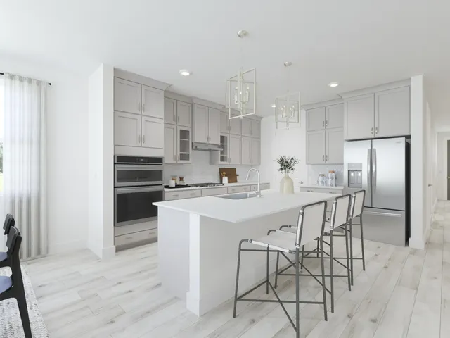 a living room with furniture a window and a flat screen tv