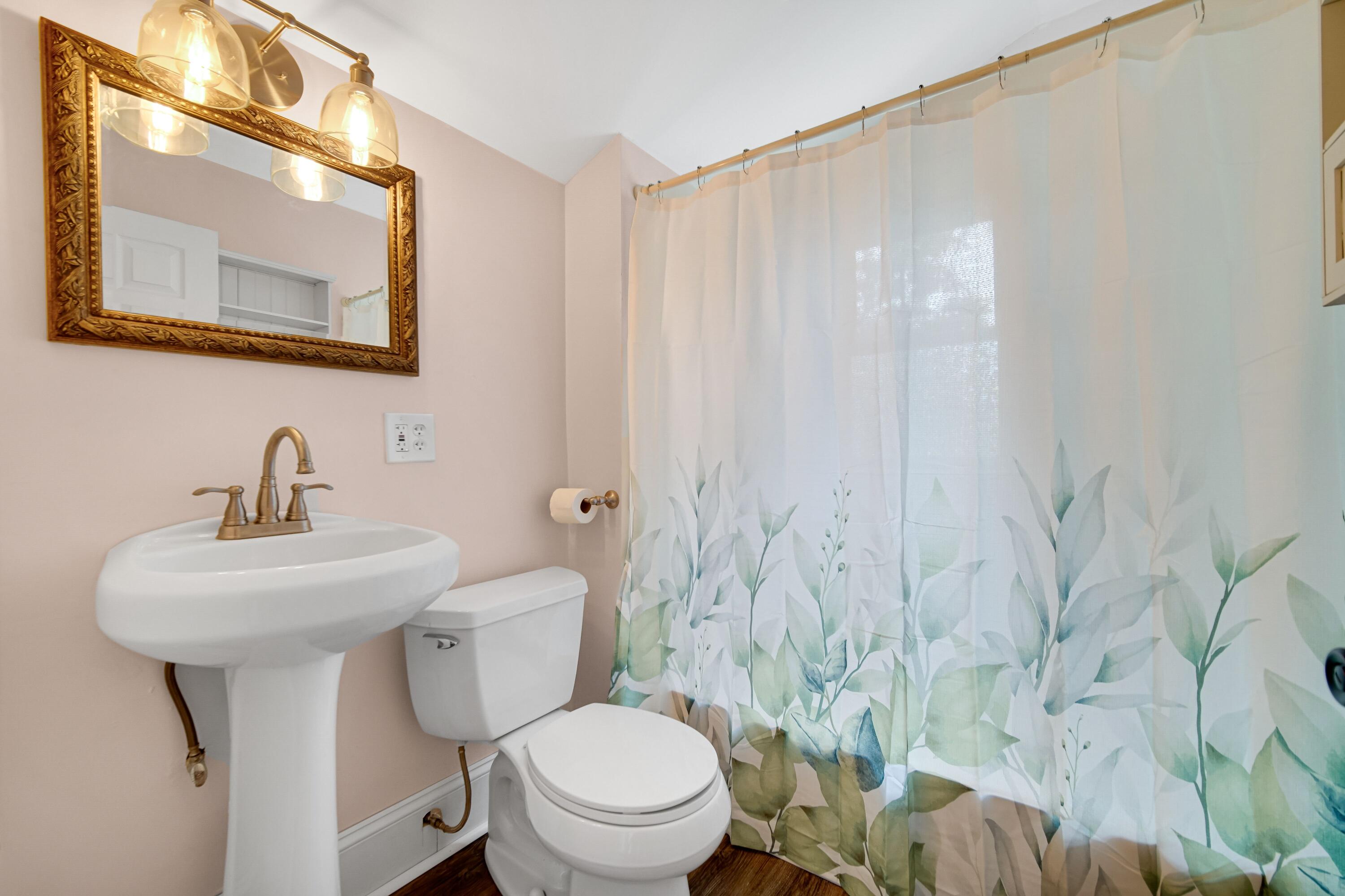476 Highway 2 Hebron, IN 46341 - Photo 16 of 25 a bathroom with a toilet sink and mirror