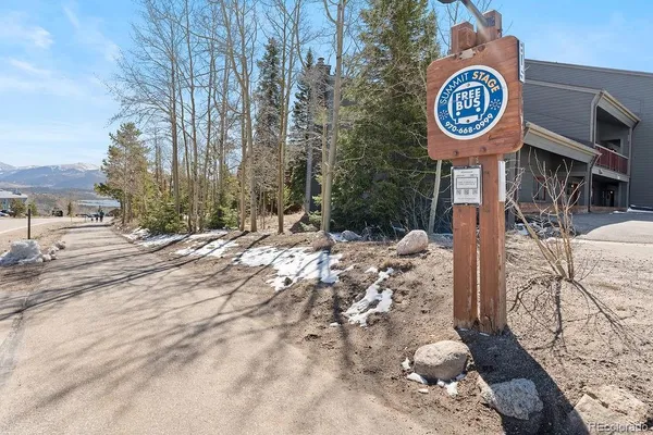 a view of a street with snow on the road