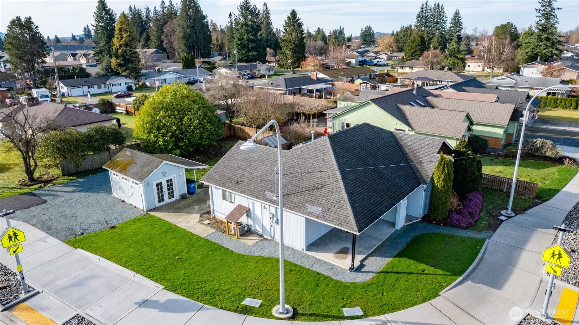827 John Liner Road Sedro-Woolley, WA 98284 - Photo 2 of 36 a view of a swimming pool and lounge chairs