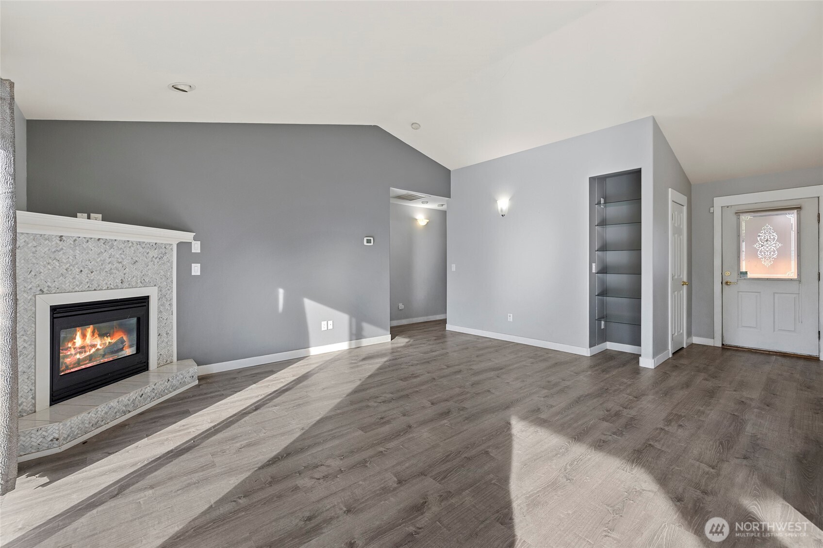 827 John Liner Road Sedro-Woolley, WA 98284 - Photo 4 of 36 a view of an empty room with fire place and a fireplace