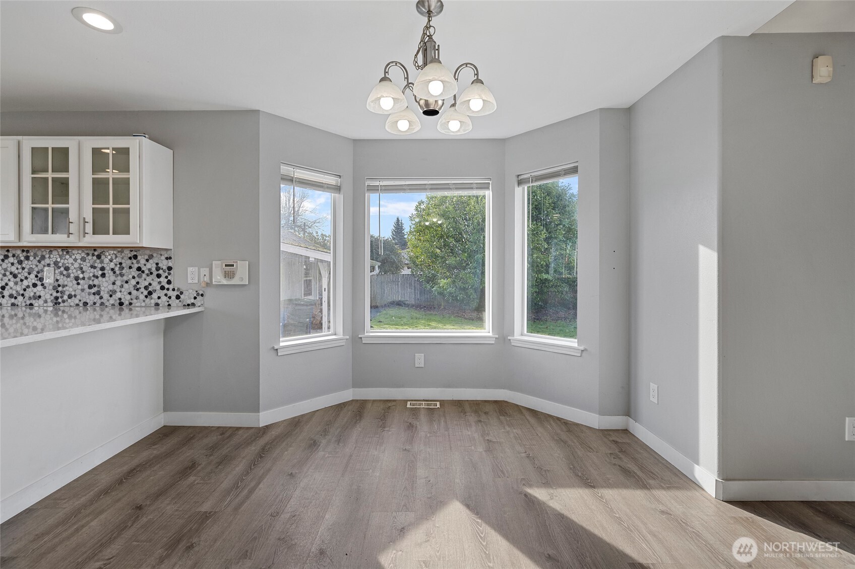 827 John Liner Road Sedro-Woolley, WA 98284 - Photo 7 of 36 wooden floor in an empty room with a window
