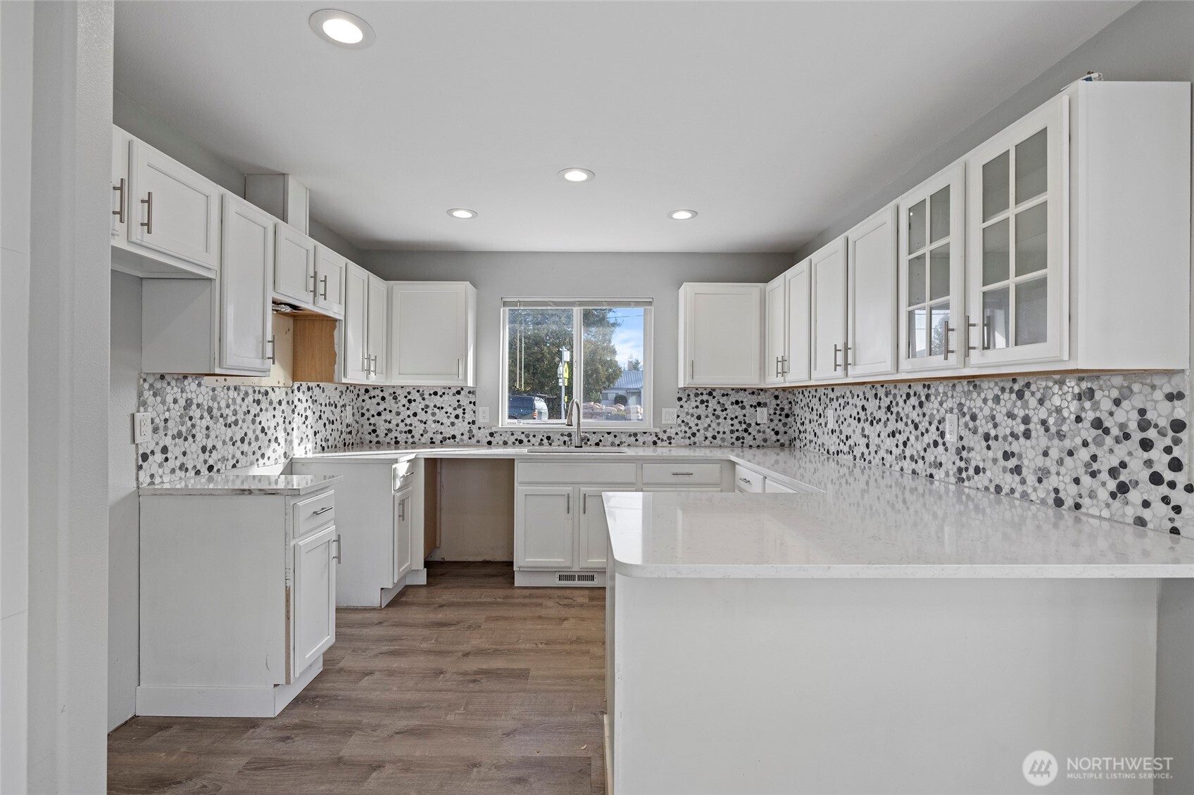 827 John Liner Road Sedro-Woolley, WA 98284 - Photo 9 of 36 a kitchen with white cabinets and sink