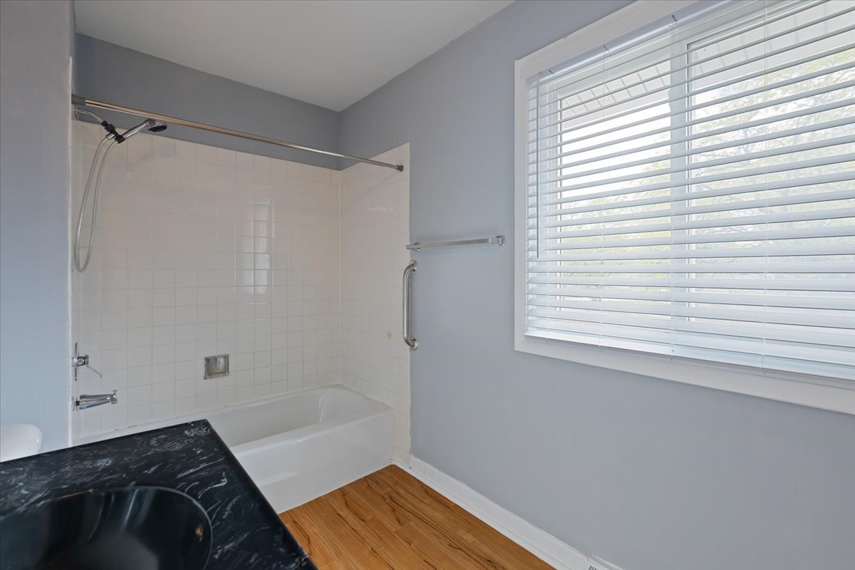246 Monroe Road Bolingbrook, IL 60440 - Photo 22 of 32 a bathroom with a bathtub and a shower
