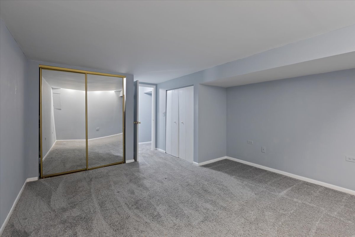 246 Monroe Road Bolingbrook, IL 60440 - Photo 24 of 32 an empty room with glass door