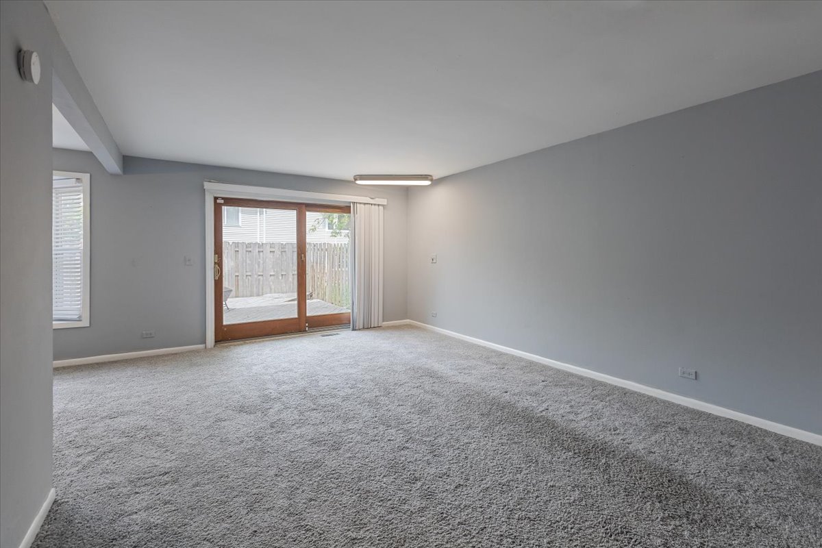 246 Monroe Road Bolingbrook, IL 60440 - Photo 6 of 32 a view of an empty room with a window