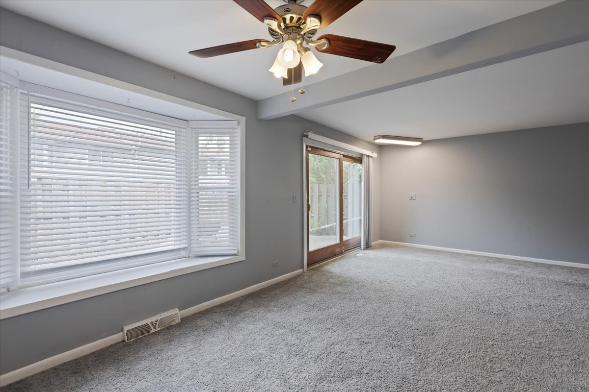 246 Monroe Road Bolingbrook, IL 60440 - Photo 9 of 32 a view of an empty room with a window
