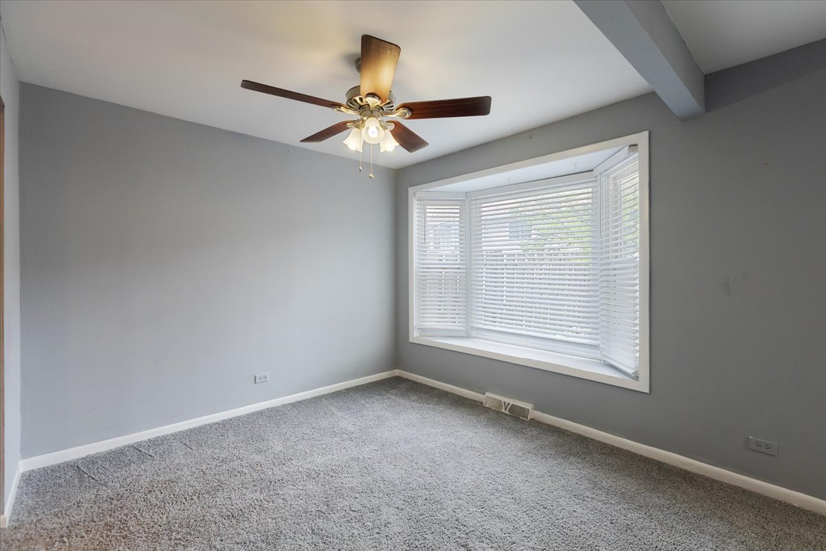 246 Monroe Road Bolingbrook, IL 60440 - Photo 10 of 32 a view of an empty room with a window