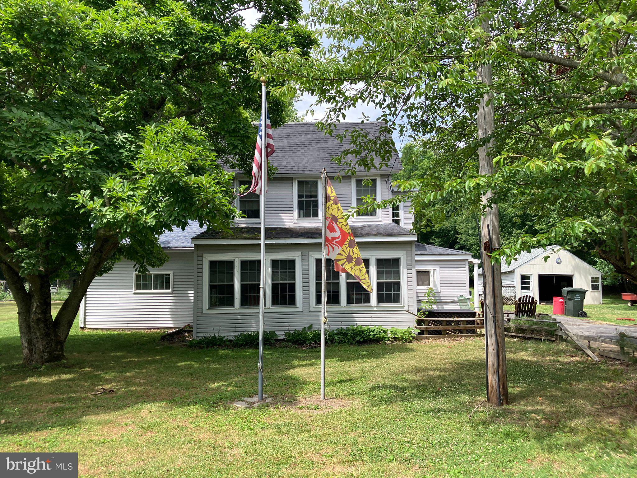 4818 Piney Neck Road Rock Hall, MD 21661 - Photo 1 of 3 Charming home with lush greenery.