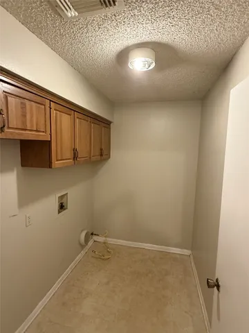 a view of a hardwood & utility room