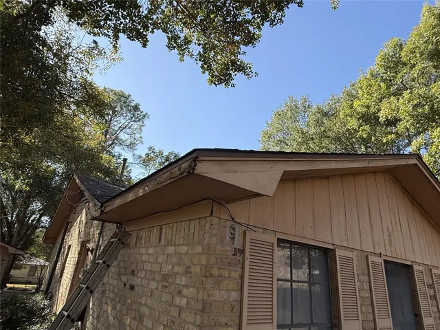 a house with trees in the background
