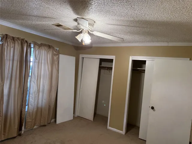a view of a hallway with closet area
