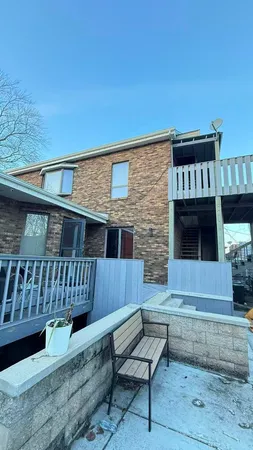 a view of house with a deck