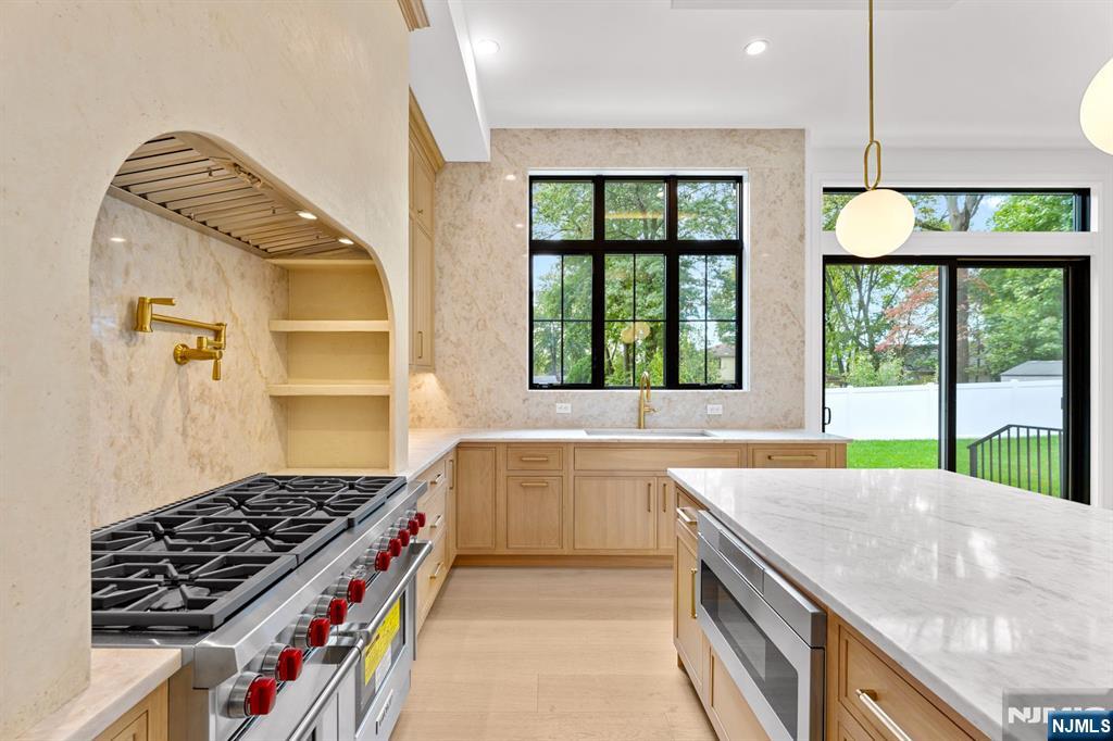 156 Stuart Street Paramus, NJ 07652 - Photo 12 of 47 a kitchen that has a stove and a sink