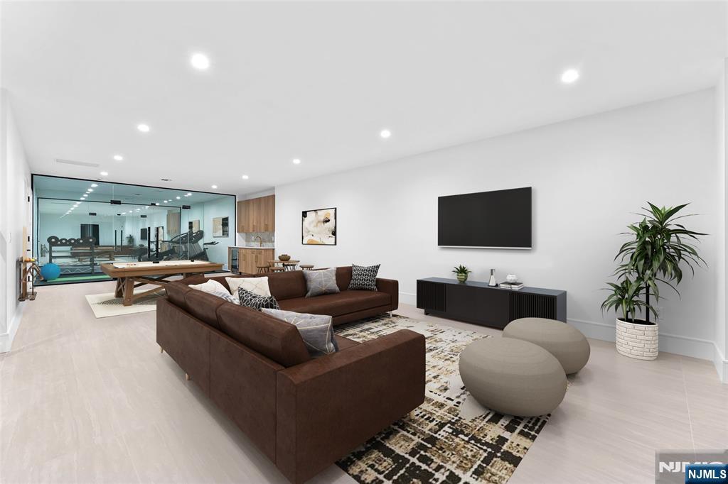 156 Stuart Street Paramus, NJ 07652 - Photo 13 of 47 a living room with furniture and a flat screen tv