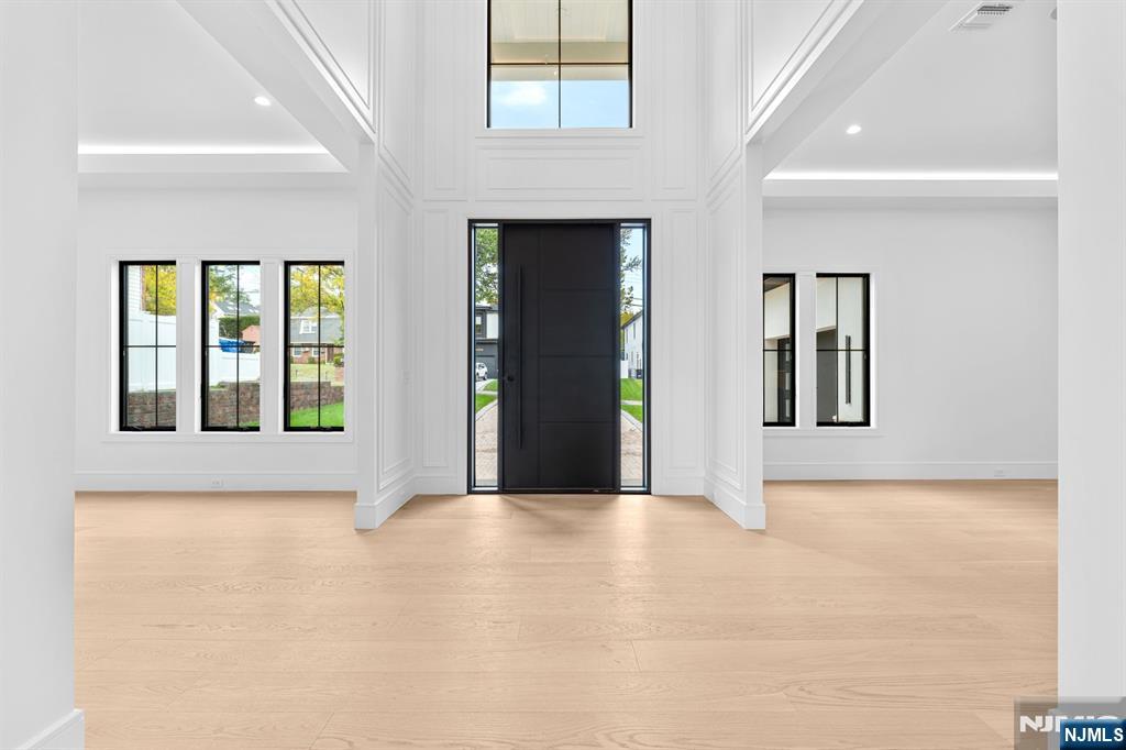 156 Stuart Street Paramus, NJ 07652 - Photo 4 of 47 a view of an empty room with window and kitchen view