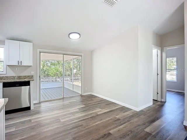 a view of a kitchen with a sink and a window