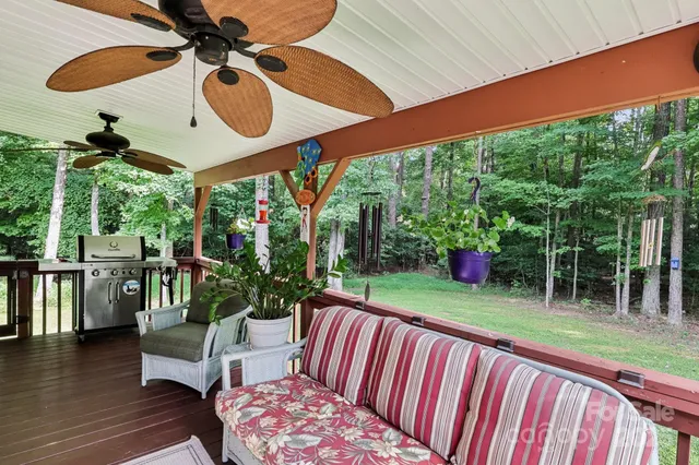 a view of a house with a yard and sitting area