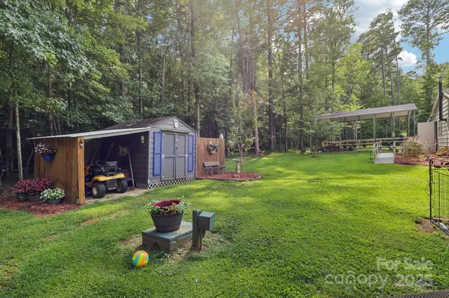 a backyard of a house with plants and outdoor space
