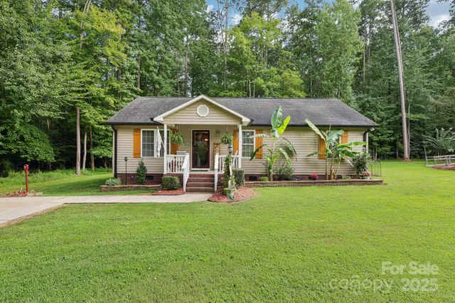 a view of a house with a yard porch and sitting area