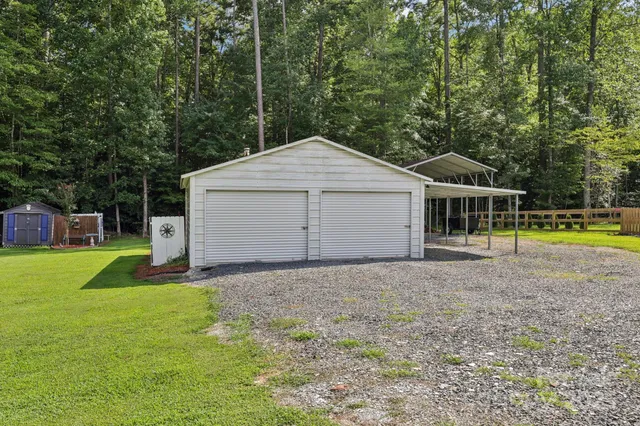 a house with green field in front of it