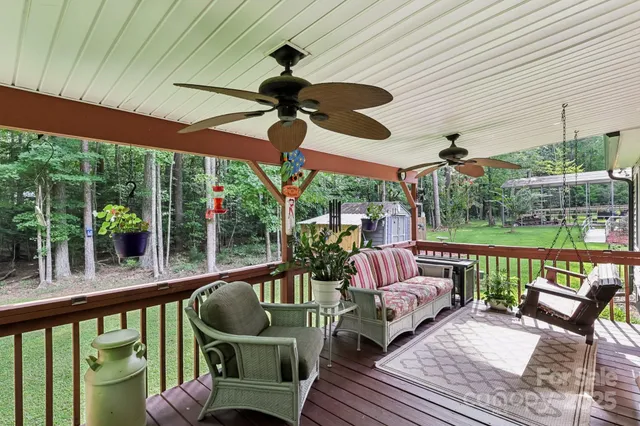 a balcony with furniture and garden view