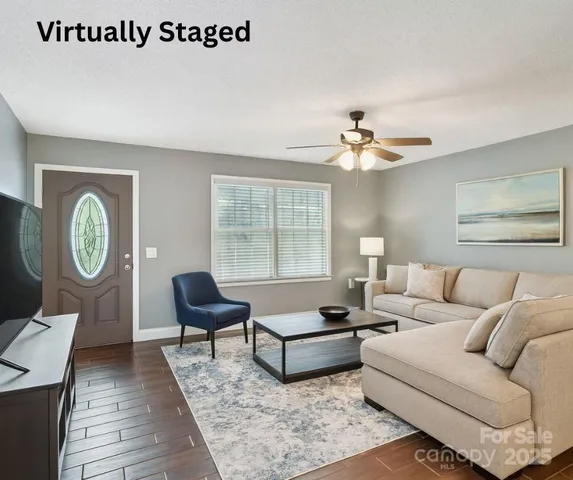 a living room with furniture and a large window