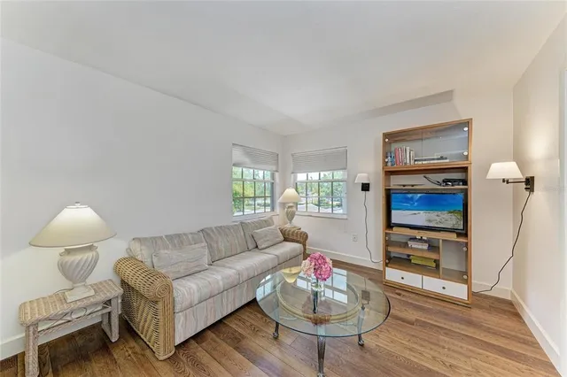 a view of a chairs and table in the balcony