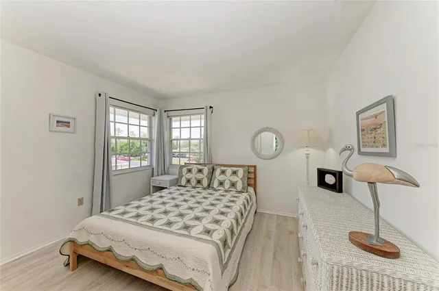 an aerial view of a house with a garden and lake view
