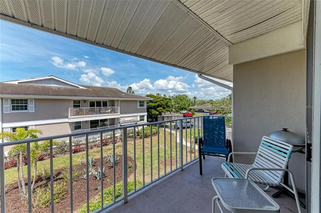 an aerial view of a house with a garden and lake view